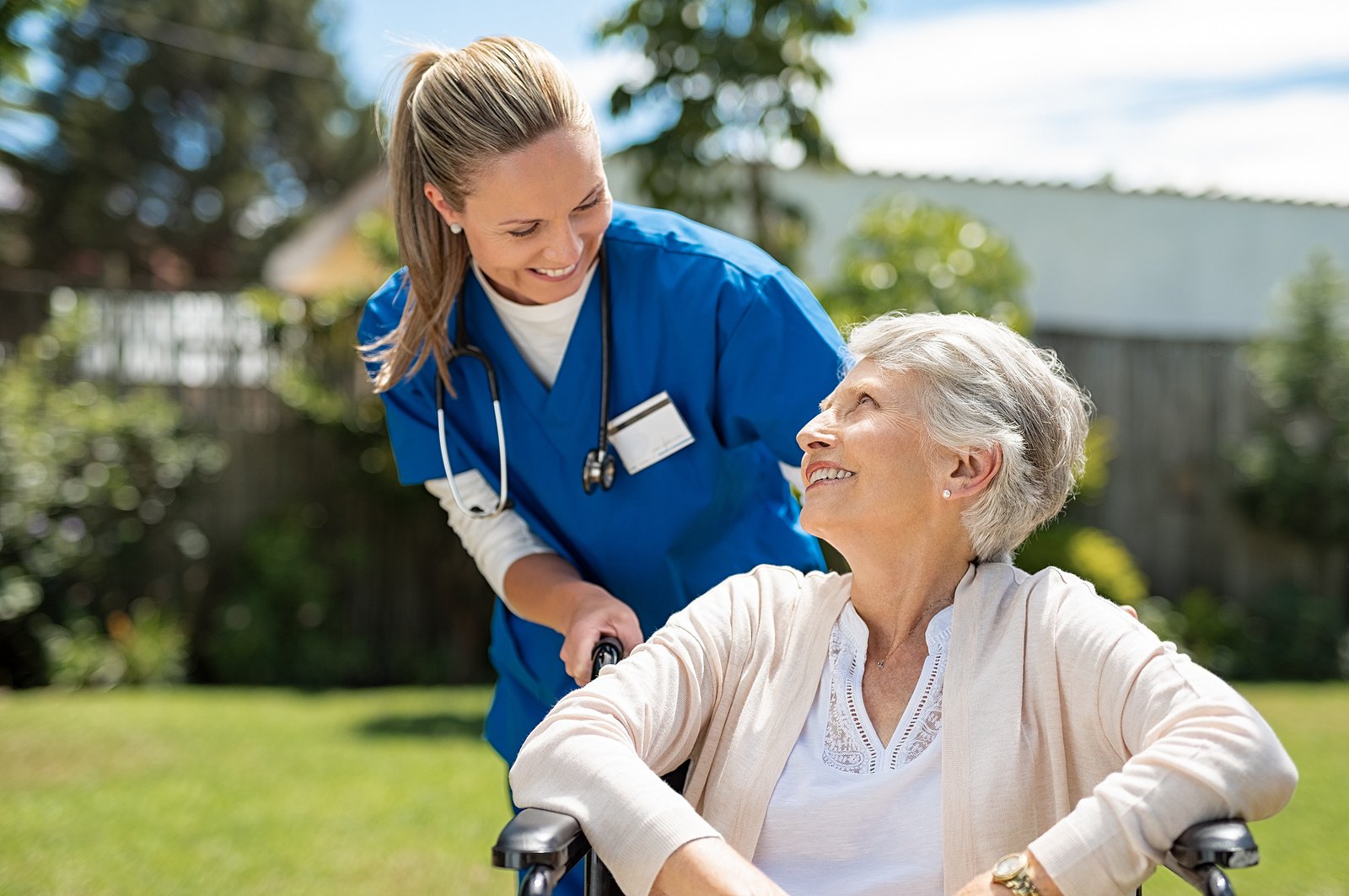 nurse assisting wheelchair 