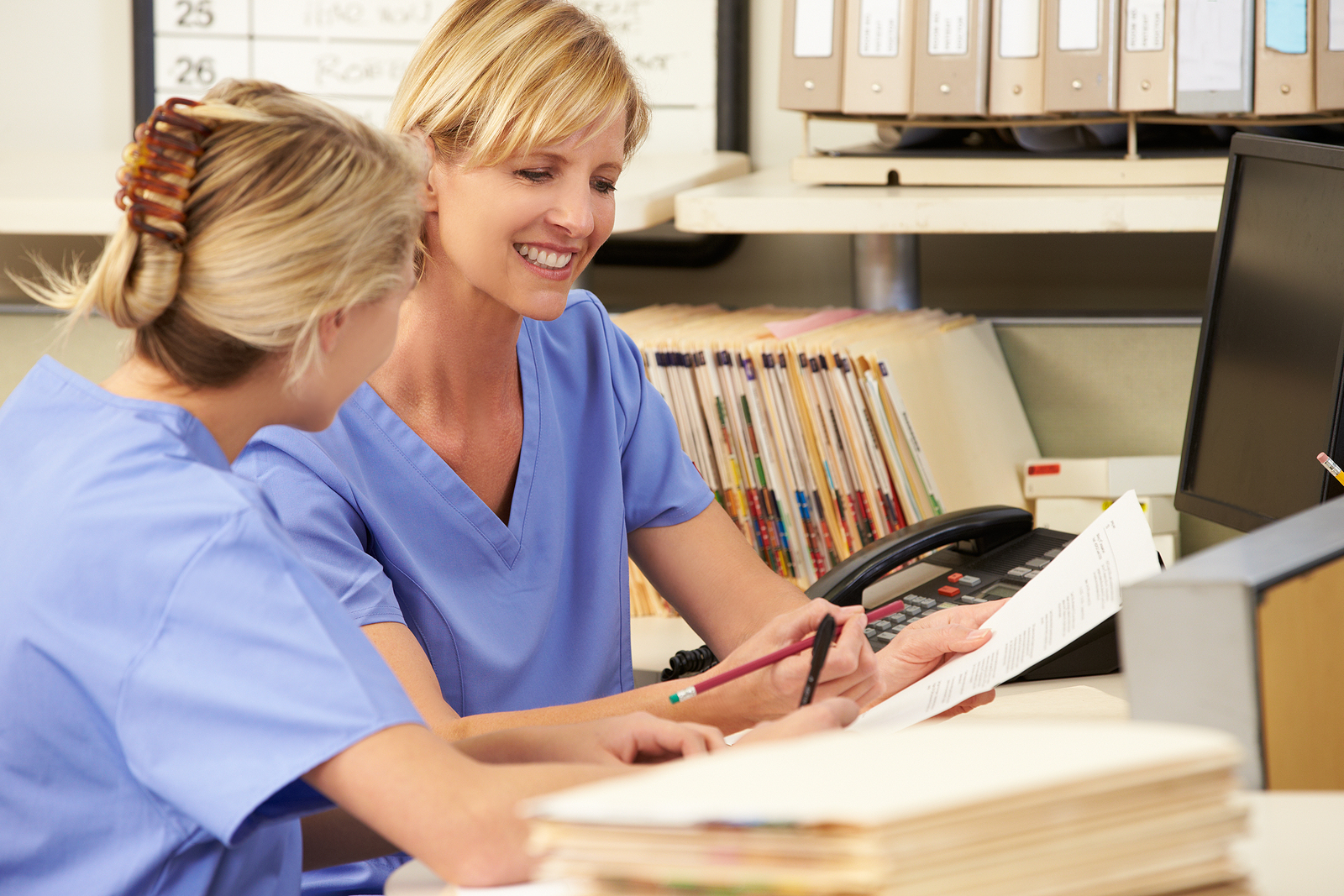 bigstock-Two-Nurses-Working-At-Nurses-S-41238661